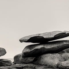 Stack of large rocks against a plain background.
Stack of large stones against a plain background. black and white landscape photograph. Fine art photograph