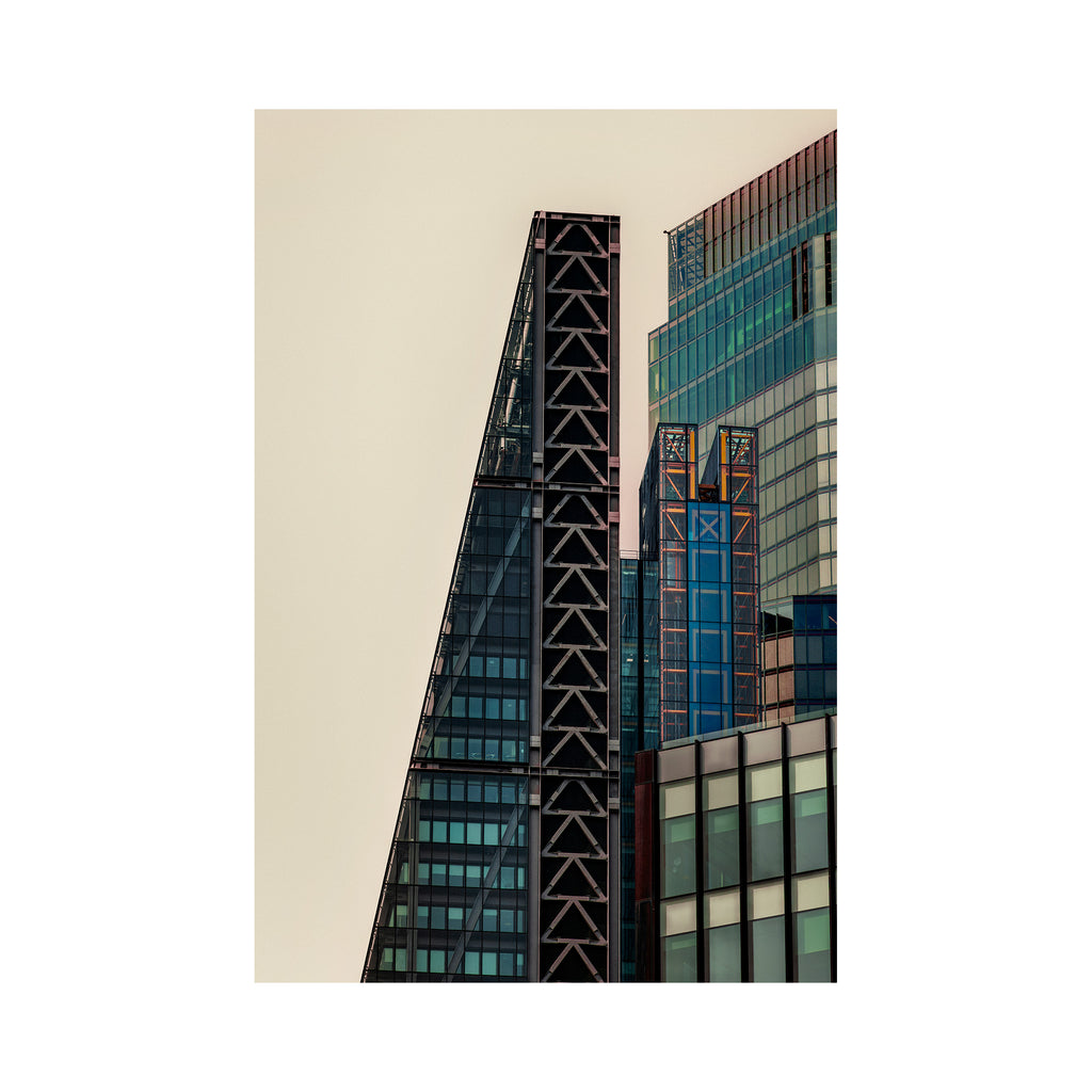 Tall modern buildings with geometric design against a beige background