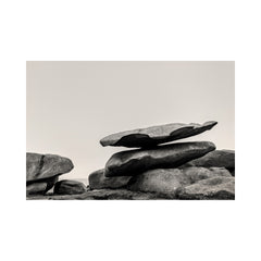 Stack of large stones against a plain background. black and white landscape photograph. Fine art photograph