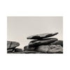 Stack of large stones against a plain background. black and white landscape photograph. Fine art photograph