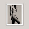 Framed black and white art print of a nude figure on a beige background
